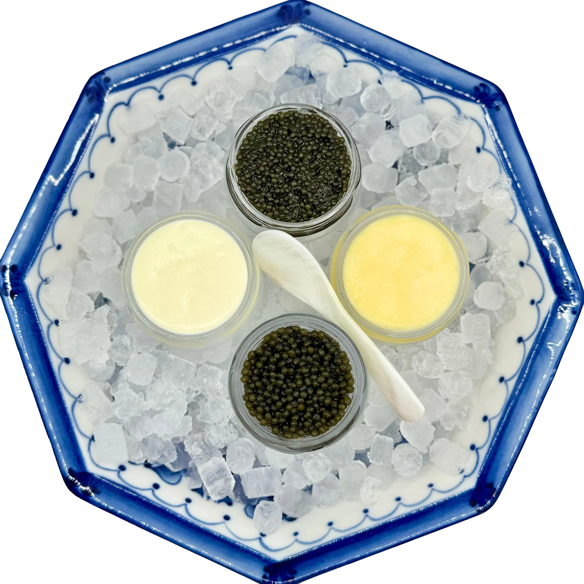 Russian Ossetra and Kaluga Hybrid Caviar on a bed of ice with French butter and Creme Fraiche.